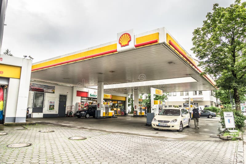 Shell petrol station with customers and copy space. Shell petrol station with customers and copy space