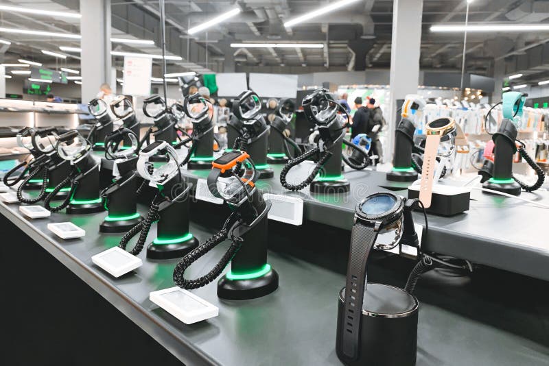 Shelve with Smart Watch in the Electronics Store. Many Smart Watches