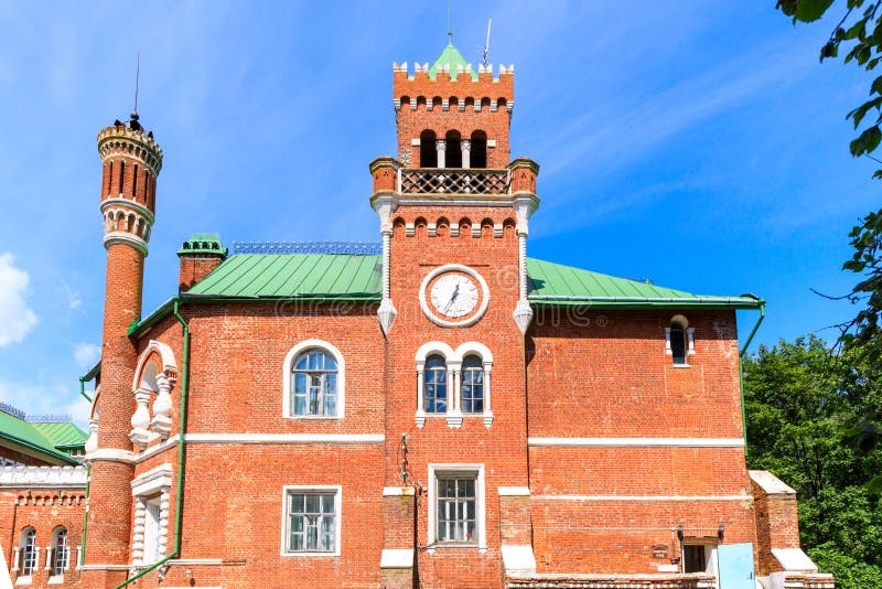 Sheremetev castle palace and park ensemble in the village of Yurino on the bank of the Volga, combination of different architectural styles in one building. Cloudy weather at the beginning of summer. Different color styles stock images, royalty-free photos and pictures