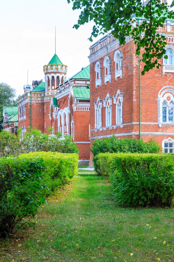 Sheremetev castle palace and park ensemble in the village of Yurino on the bank of the Volga, combination of different architectural styles in one building. Cloudy weather at the beginning of summer. Different color styles stock images, royalty-free photos and pictures