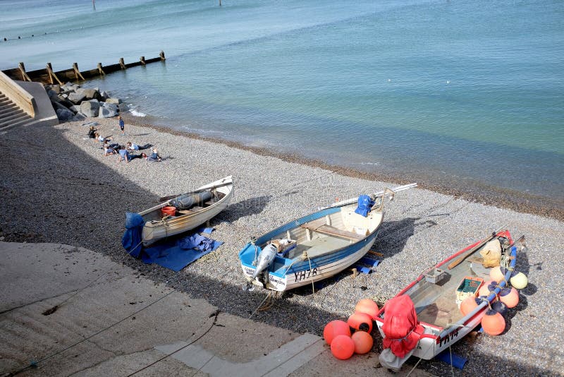 Sheringham, Norfolk, UK. September 24, 2016. Fishing boats and holidaymakers on the beach in September at Sheringham in Norfolk.