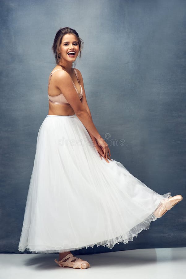 Shes a ballet beauty. Portrait of a beautiful young woman posing in studio while wearing a bra and ballet skirt.