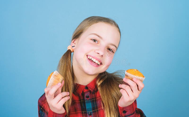 Shes so sweet that makes the food taste good. Small girl smiling with freshly baked dessert food. Happy little child stock photography Shes so sweet that makes the food taste good. Small girl smiling with freshly baked dessert food. Happy little child stock photography