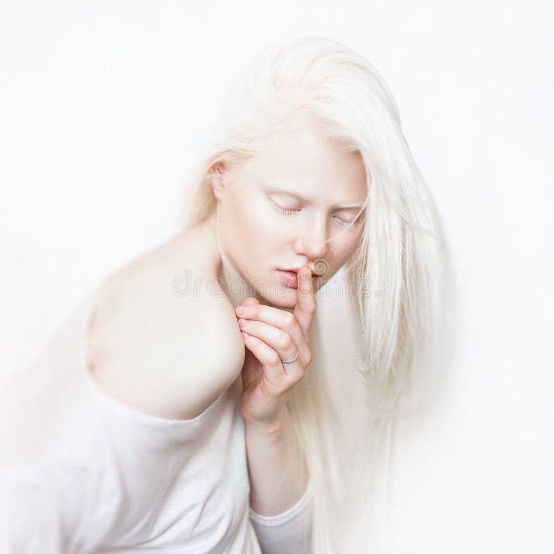 Shhh gesture. Albino female with white skin and white long hair. Photo face on a light background. Blonde girl