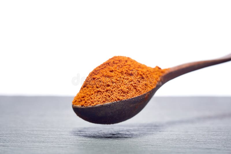 Shichimi pepper in Wooden spoon on black plate, stock image Shichimi pepper in Wooden spoon on black plate, stock image