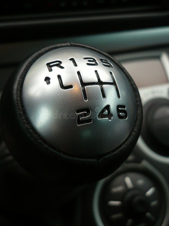 Close up of shift knob with 6 gears in car interior