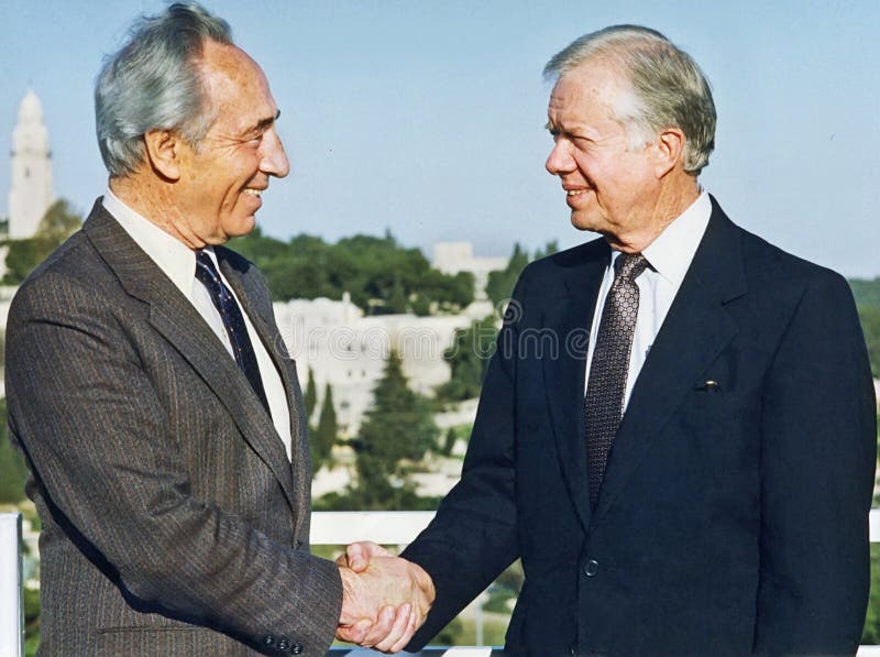 Polish-born Israeli statesman and politician Shimon Peres was a protege of Israeli founding father and first prime minister, David Ben-Gurion. Peres was a 2-time prime minister and also served as Israel&#x27;s president, significantly expanding its ceremonial role and continuing to carry on international diplomacy. A pragmatic leader, he joined with his Labor Party rival Yitzhak Rabin to engage Yasser Arafat in the Oslo Accords, and all three received the Nobel Peace Prize for their efforts. Peres served in 12 cabinets in such capacities as prime minister, foreign minister, and defense minister. Peres died at 93 from the effects of a massive stroke, in Ramat Gan, Israel on September 28, 2016. He was photographed here at the Diaspora Museum in Ramat Aviv, Israel in 1986. Here, then Foreign Minister Peres meets with former US president Jimmy Carter on March 19, 1998 in Jerusalem. Polish-born Israeli statesman and politician Shimon Peres was a protege of Israeli founding father and first prime minister, David Ben-Gurion. Peres was a 2-time prime minister and also served as Israel&#x27;s president, significantly expanding its ceremonial role and continuing to carry on international diplomacy. A pragmatic leader, he joined with his Labor Party rival Yitzhak Rabin to engage Yasser Arafat in the Oslo Accords, and all three received the Nobel Peace Prize for their efforts. Peres served in 12 cabinets in such capacities as prime minister, foreign minister, and defense minister. Peres died at 93 from the effects of a massive stroke, in Ramat Gan, Israel on September 28, 2016. He was photographed here at the Diaspora Museum in Ramat Aviv, Israel in 1986. Here, then Foreign Minister Peres meets with former US president Jimmy Carter on March 19, 1998 in Jerusalem.