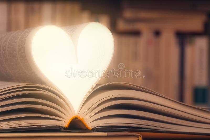 Shining heart shape made with book pages closeup. Love reading concept with copy space. Knowledge, literature, novel, literacy