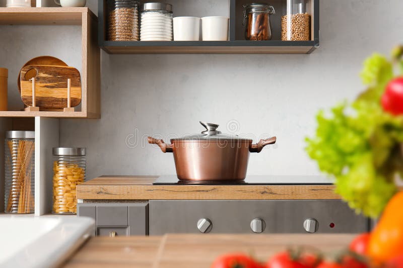 Shiny Cooking Pot on Stove in Modern Kitchen Stock Image - Image of ...