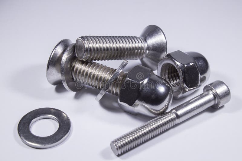 Shiny Countersunk Bolts on White Background on Table Stock Image