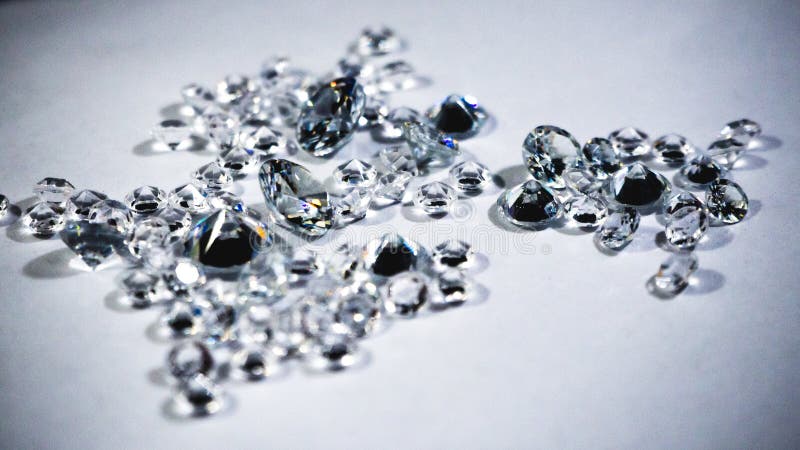 Shiny Diamonds Stones Laying on White Table Stock Image - Image of ...