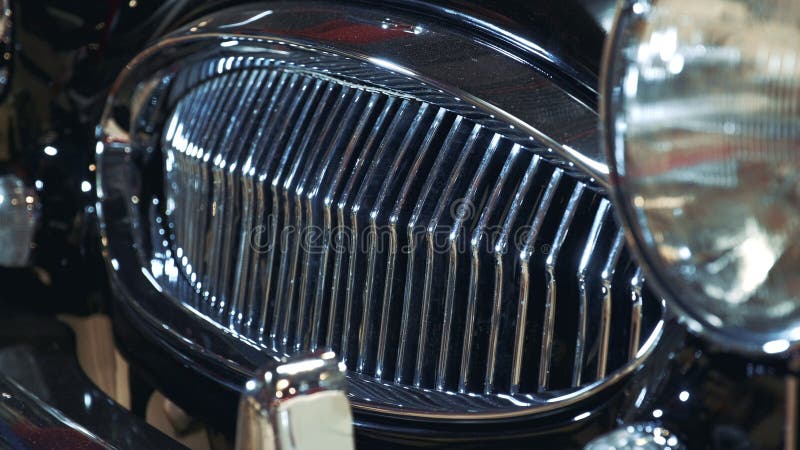 Shiny front radiator grill of black luxury retro car royalty free stock photo Shiny front radiator grill of black luxury retro car royalty free stock photo