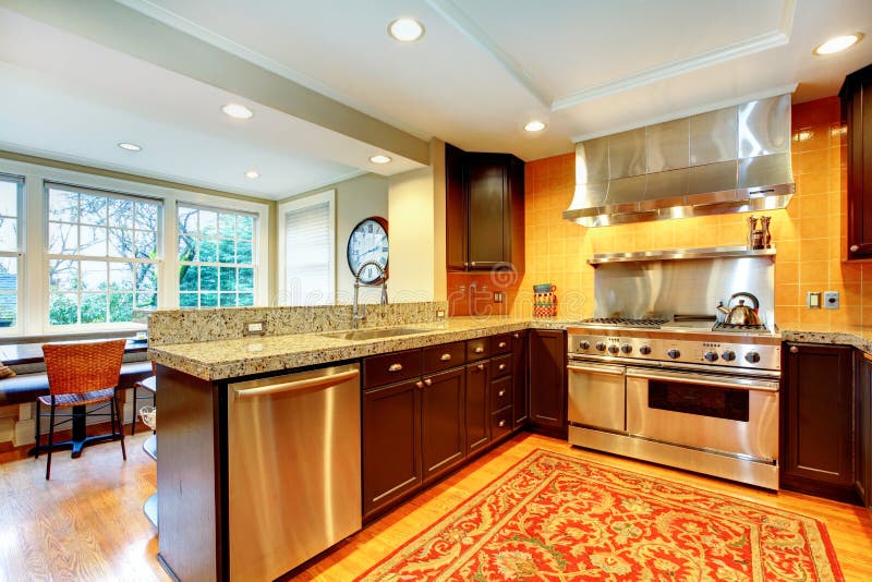 Shiny kitchen with black wood cabinets