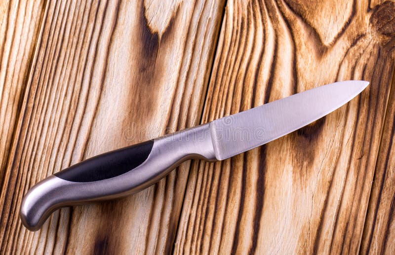 Set of Shiny Metal Kitchen Knives on a Wooden Table Stock Photo Image