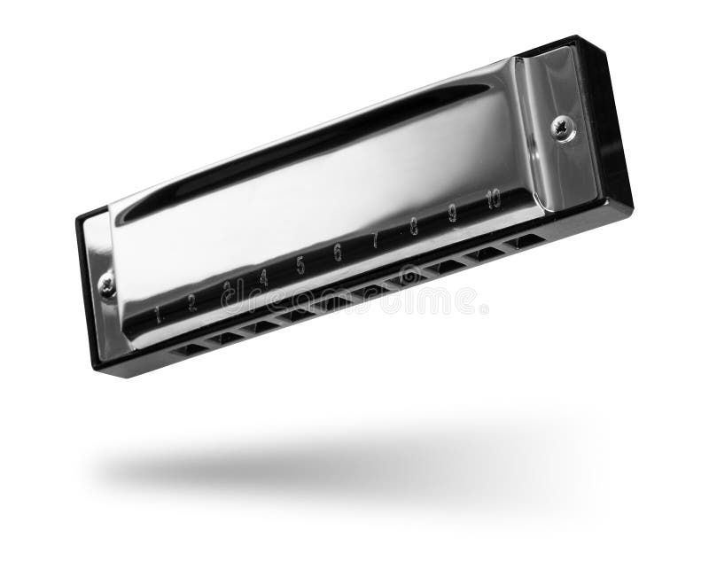 Shiny new metal traditional folk harmonica mouth music instrument isolated white background. western country french harp concept royalty free stock photo Shiny new metal traditional folk harmonica mouth music instrument isolated white background. western country french harp concept royalty free stock photo