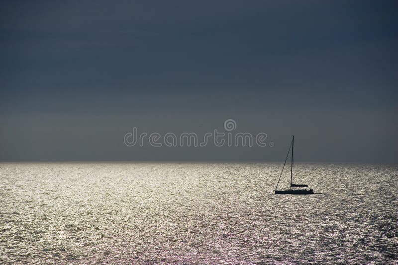 Shiny sea and sailboat