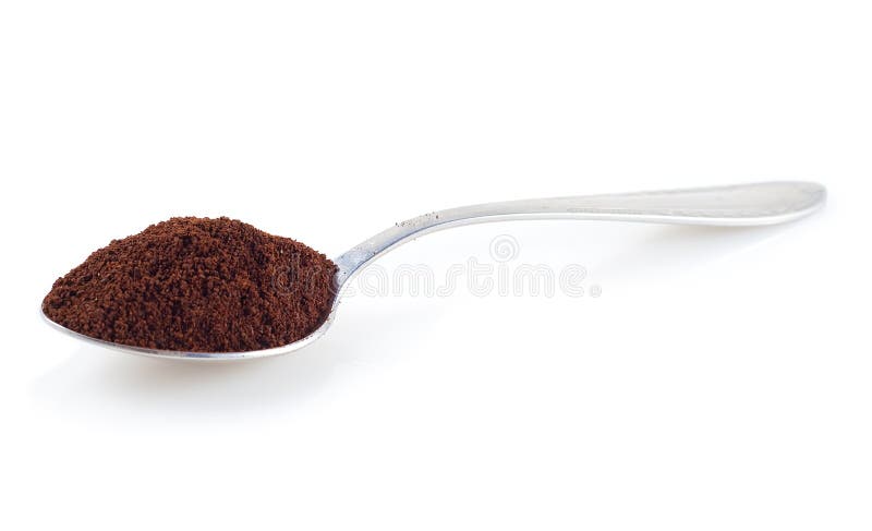 Shiny silver spoon filled with coffee on a white background