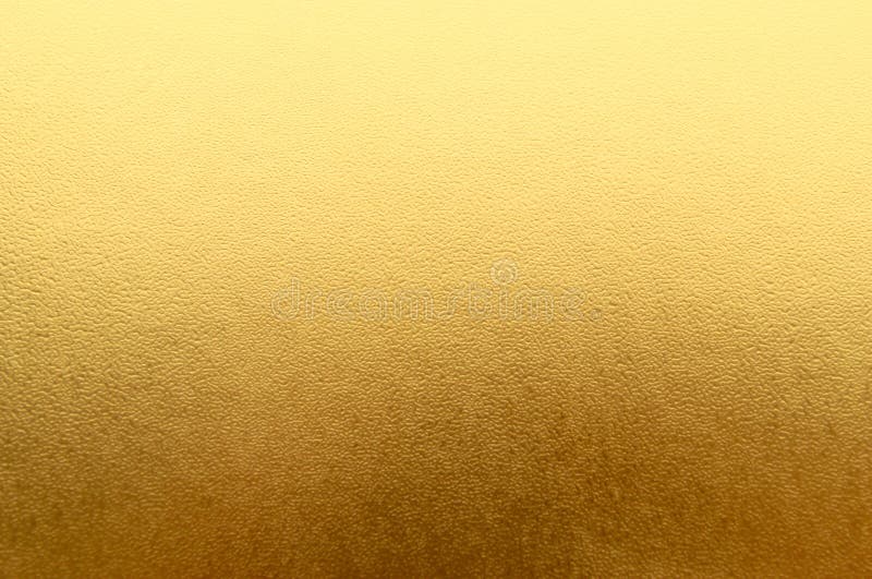 Shiny yellow metallic gold leaf foil texture background