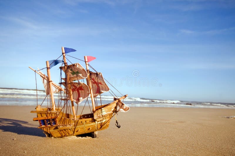 Ship model on summer sunny beach