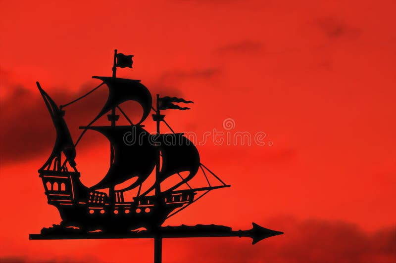 Ship Weather Vane against a Red Sky at Sunset royalty free stock photo Ship Weather Vane against a Red Sky at Sunset royalty free stock photo