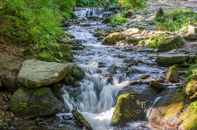Shipot waterfall on a mountain river among stones and rocks in the Ukrainian Carpathians