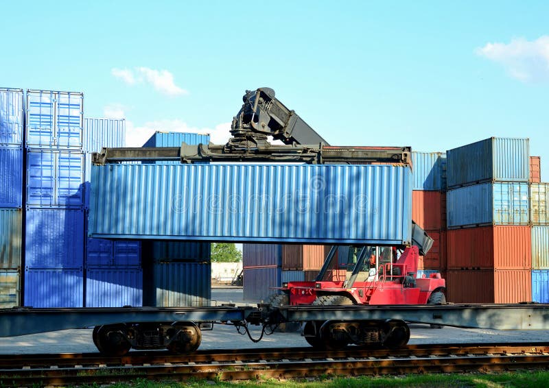 Shipping Container Loading by Richtracker on the Freight Rail Car at Logistic Warehouse Port