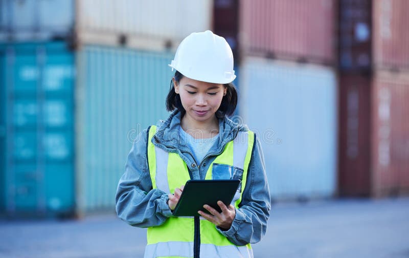 Shipping, container and logistics management by woman on digital tablet stock and cargo checklist supply chain. Factory, industry and delivery by asian woman check warehouse ecommerce online order.