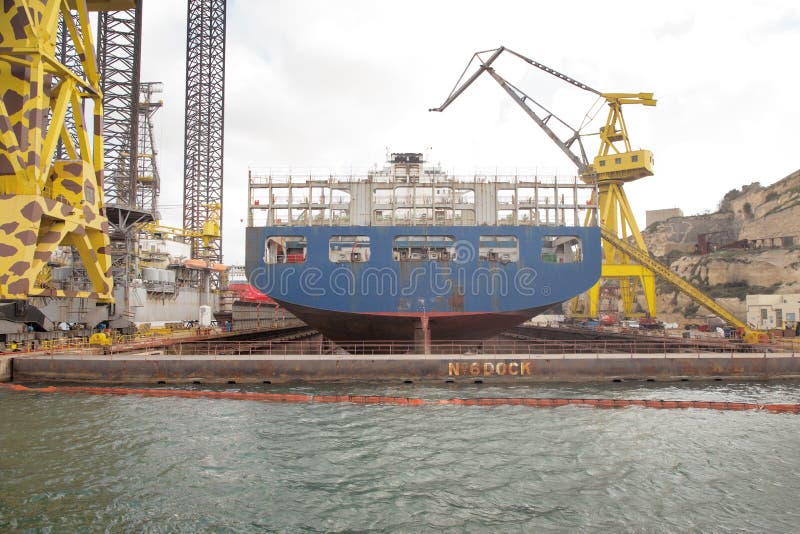 Shipping dockyard in malta stock image. Image of crane 189581081