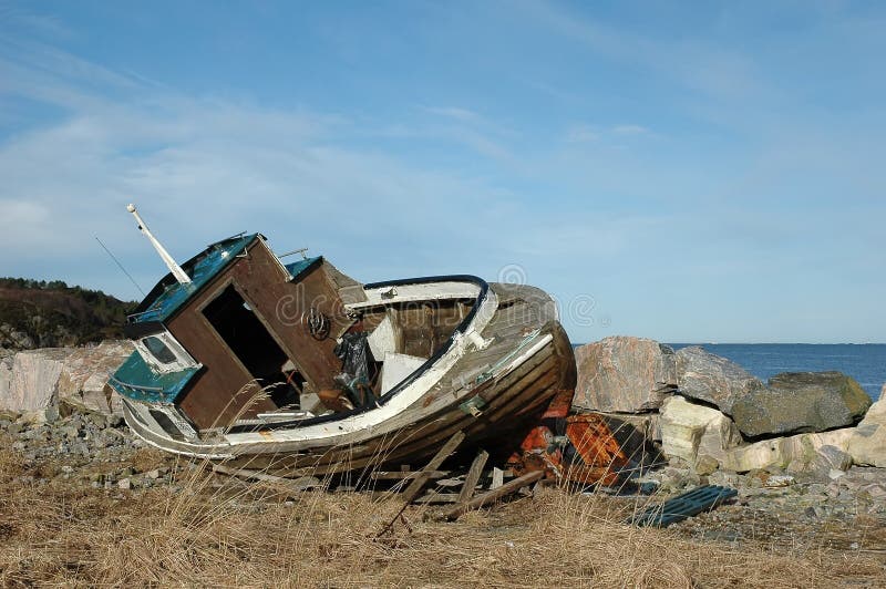 Shipwreck on a beach stock photography