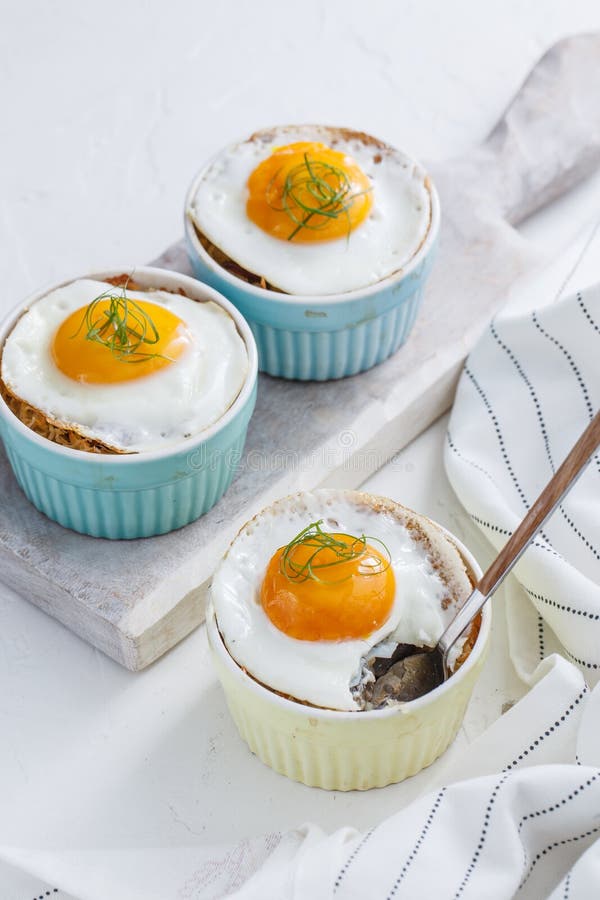 Shirred baked eggs for breakfast. Selective focus copy space. Shirred baked eggs for breakfast. Selective focus copy space.