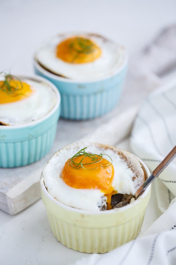 Shirred baked eggs for breakfast. Selective focus copy space. Shirred baked eggs for breakfast. Selective focus copy space.