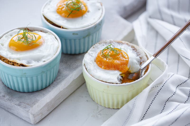 Shirred baked eggs for breakfast. Selective focus copy space. Shirred baked eggs for breakfast. Selective focus copy space.