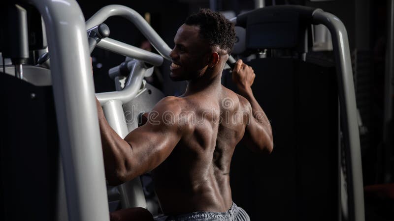 Premium Photo  Healthy man doing back exercises in the gym with dumbbell