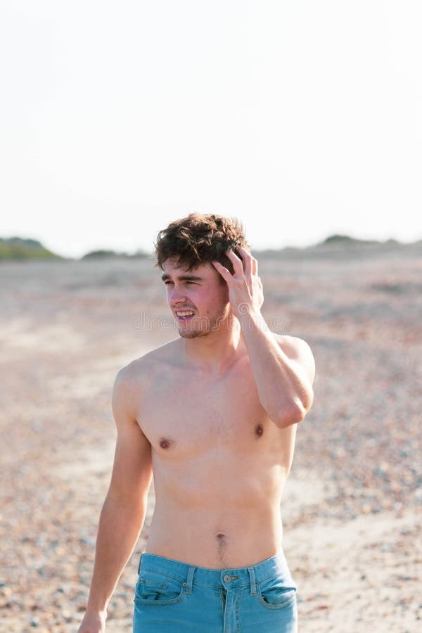 Shirtless on a beach stock image. Image of adult, healthy - 157643843