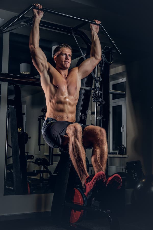 A Man Doing Abs Workouts on Pull Up Bar. Stock Image Image of