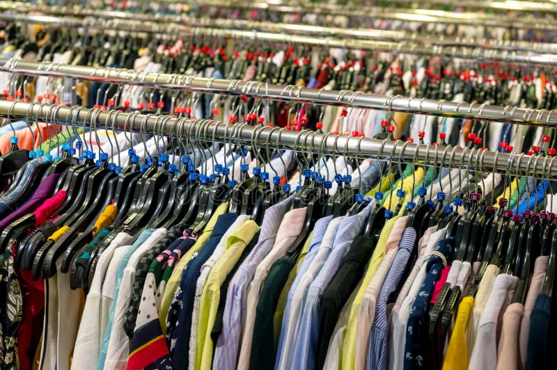 https://thumbs.dreamstime.com/b/shirts-blouses-vests-clothes-rack-bulk-goods-different-colored-offered-sale-retail-outlets-230570555.jpg