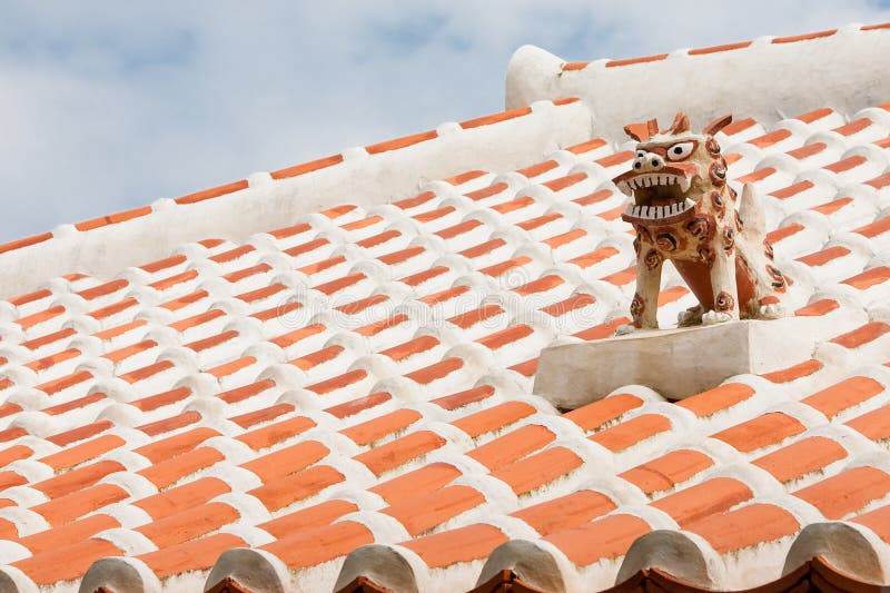 A guardian shisa lion dog, on the roof of an Okinawan home.