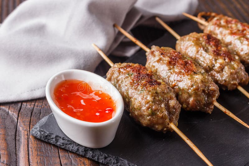 Shish Kebab on the Skewers with Sauce on Rustic Table Stock Image Image of skewers, sauce