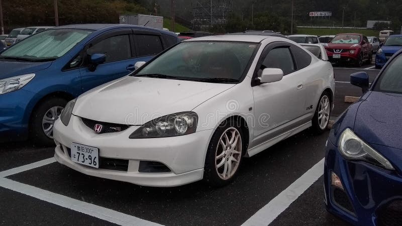 Shizuoka Japan September 8 2018 white Honda Integra Type R DC5 in a parking lot. Honda Integra Type R DC5 is the last generation of Honda Integra. Powered by K20 engine that produced 217 horsepower sent the power to front wheels and through six speed manual transmission. This car only available in coupe body style and also known as Acura rsx in usa. Shizuoka Japan September 8 2018 white Honda Integra Type R DC5 in a parking lot. Honda Integra Type R DC5 is the last generation of Honda Integra. Powered by K20 engine that produced 217 horsepower sent the power to front wheels and through six speed manual transmission. This car only available in coupe body style and also known as Acura rsx in usa