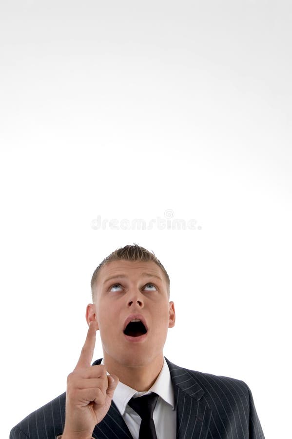 Shocked businessman pointing upward