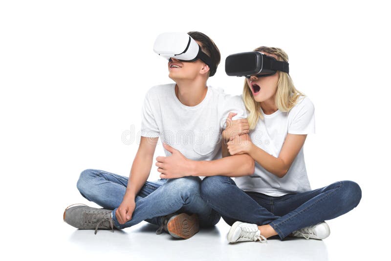 Shocked couple using virtual reality headsets stock photography