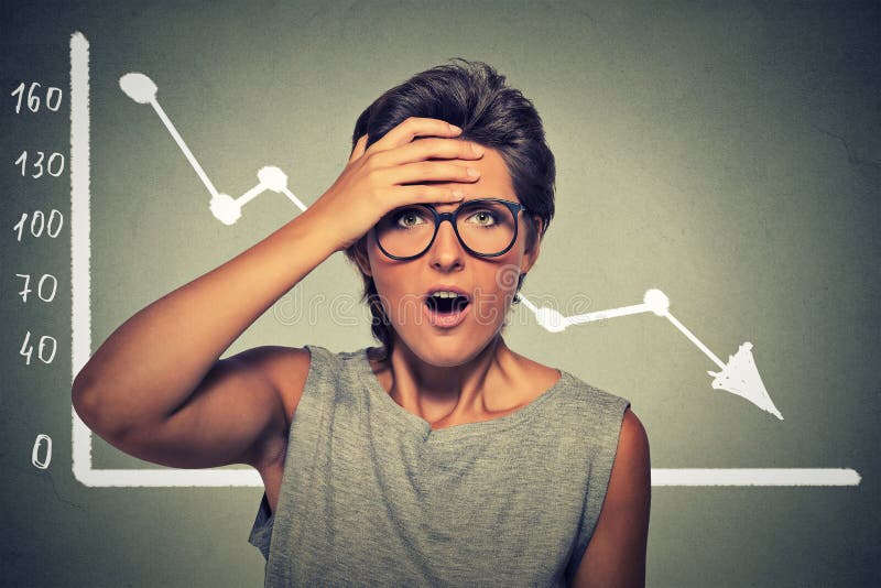 Shocked woman with financial market chart graphic going down stock photo Shocked woman with financial market chart graphic going down stock photo