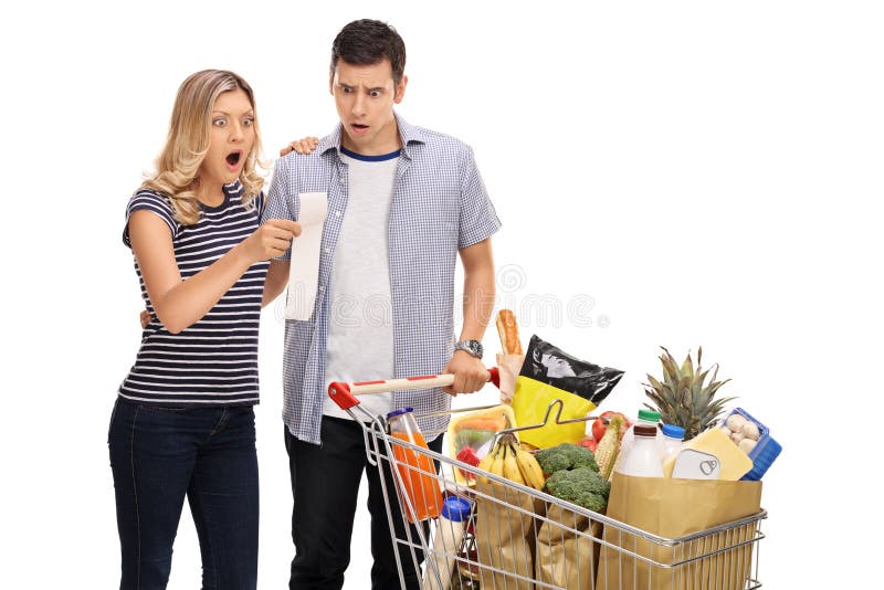 Shocked young couple looking at a shopping bill stock photos