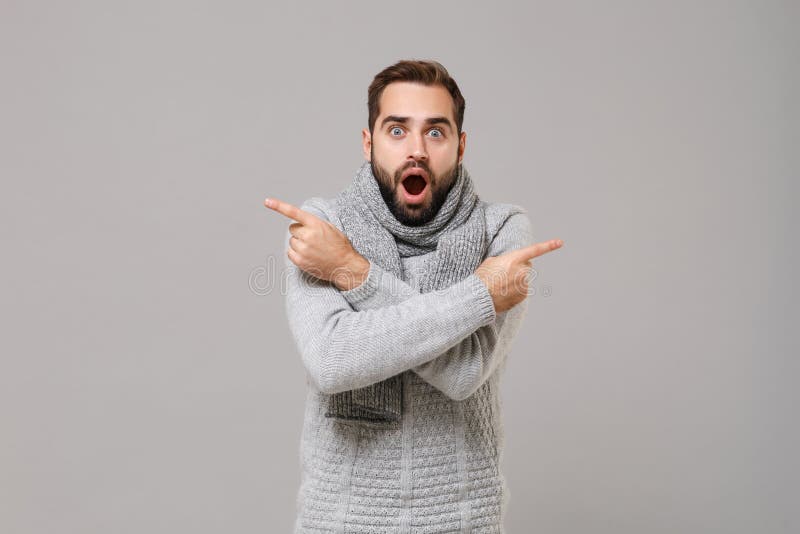 Shocked Young Man in Gray Sweater, Scarf Posing Isolated on Grey ...