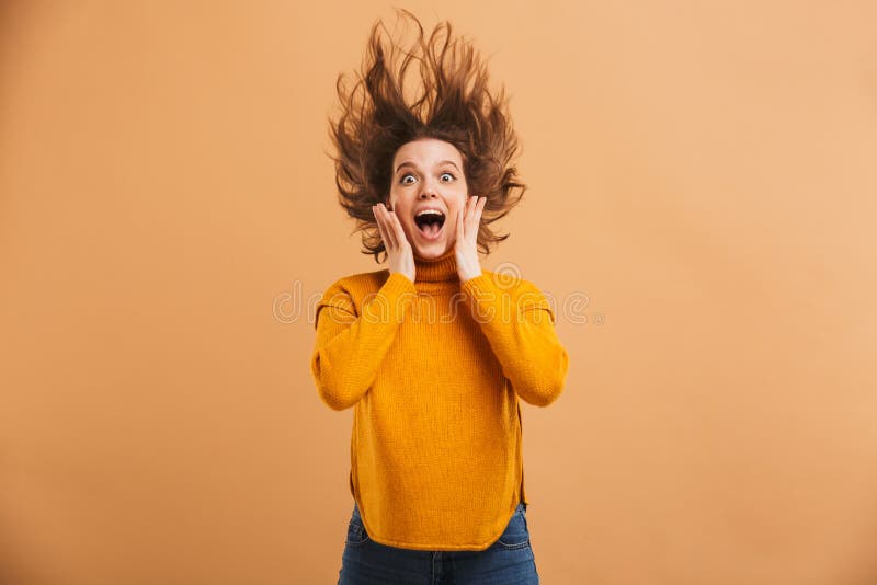 Shocked young woman looking camera.