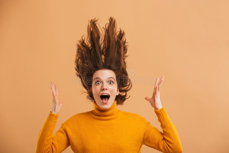 Shocked young woman looking camera.