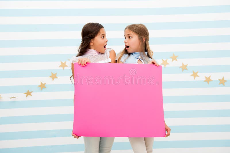 Shocking announcement concept. Amazing surprising news. Girl hold advertising banner. Girls kids holding paper banner royalty free stock images Shocking announcement concept. Amazing surprising news. Girl hold advertising banner. Girls kids holding paper banner royalty free stock images
