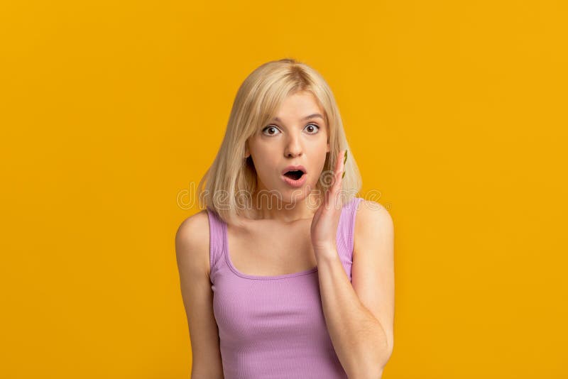 Shocking Gossip Emotional Blonde Woman Keeping Hand Near Opened Mouth