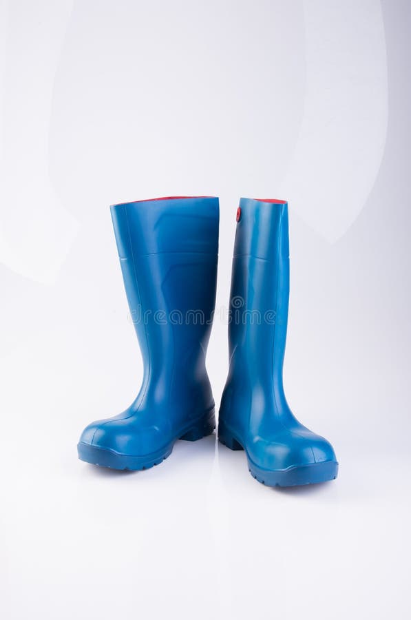 Shoe or blue color rubber boots on a background.