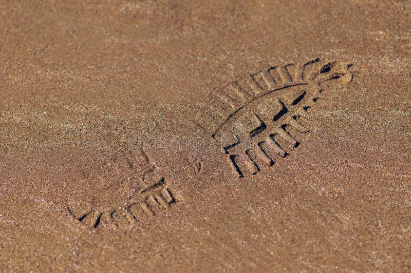 Shoe footprint on wet sand texture